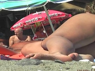 This teen nudist strips bare at a public beach