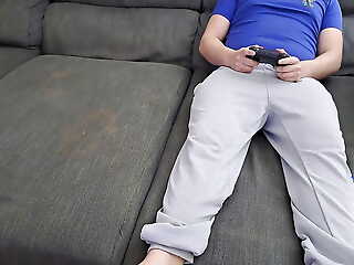 Stepsister sucks stepbrother with an increment of eats his sperm while he plays video games